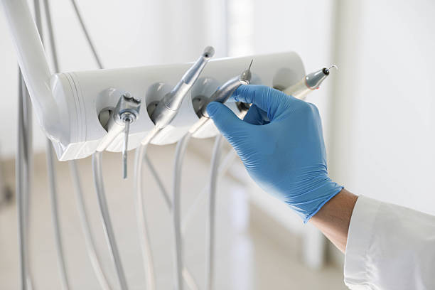 Professional Tooth Extraction technician working in Clinton, IA